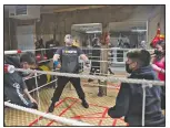  ??  ?? During warm-ups, one class member is charged with leading the group through their paces. Cavazos (center) counts the reps of his fellow pugilists.