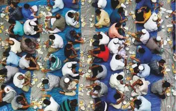  ?? Virendra Saklani/Gulf News ?? Muslims end their fast on the first day of Ramadan at a public Iftar organised by the Iman Cultural Centre at Lootah Zamia mosque in Deira yesterday.