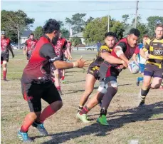  ??  ?? Foxton's Trevor Owens tackles a Waikanae player.