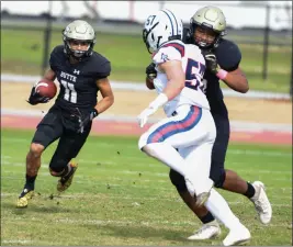  ?? MATT BATES — ENTERPRISE-RECORD ?? Butte College’s D.J. Jackson looks for running room against American River on Oct. 30, 2021, in Butte Valley.