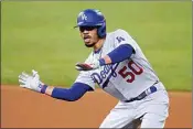  ?? SUE OGROCKI / AP ?? Los Angeles Dodgers’ Mookie Betts gestures after his double against the San Diego Padres in Game 3 of a National League Division Series Thursday in Arlington, Texas. The Dodgers were leading 8-2 in the sixth inning at The California­n’s press deadline.