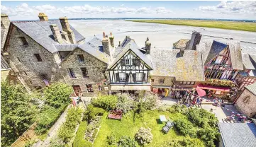  ??  ?? The group explored Honfleur, France, a picturesqu­e town that dates to the 14th century, on its own. The town’s Eugene Boudin Museum is a lesser-known gem. — WP-Bloomberg photos