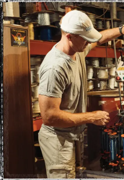  ?? : PHOTO JIM BUSH ?? Tim Ray, left, recently partnered with Tom Allen Jr.’s shop in Ontario, Canada, to rebuild his cordage company, G&amp;B Ropes. Ray keeps a watchful eye on filaments coming off the braider while Allen inspects the newly woven double-braided line.