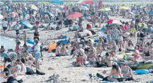  ?? FRANK GUNN THE CANADIAN PRESS ?? Before heading out to busy parties, crowded bars or packed beaches like this one in Toronto, ask yourself if it’s worth the risk to your health, federal Health Minister Patty Hajdu suggests.