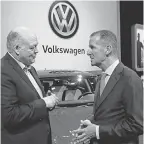  ?? AP ?? Jim Hackett, left, president and CEO of Ford, talks with Volkswagen CEO Herbert Diess in Detroit on Monday.