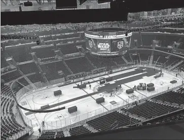  ?? Photograph­s by Jack Harris Los Angeles Times ?? STAPLES CENTER during a hockey-basketball changeover. Kings veteran Dustin Brown said, “The ice is garbage. It has been garbage. I don’t think it’s a problem you can fix when you have two basketball teams.”