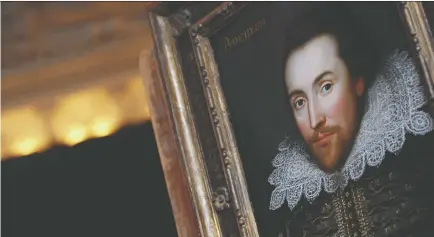  ?? LEON NEAL/AFP/GETTY IMAGES ?? Lee Durkee examined countless images of the bard, seen in a painting in London, for his book, Stalking Shakespear­e.