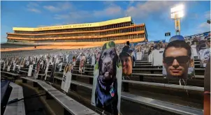  ?? The Associated Press ?? Cardboard cutouts of fans sit in the south stands before an Oct. 31, 2020, game between Penn State and Ohio State in State College, Pa. In 2021, college football will attempt to return to normal after a season roiled by the pandemic while also adapting to a new paradigm in which the athletes have more power than ever before.