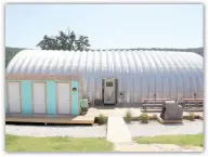  ??  ?? The Quonset hut at Flamingo Springs Trailer Resort serves as the home for owners Zack and Laura Kraus and their 1-year-old son, Gray. The resort’s office is also in the building, along with a community room that provides a kitchen and a game room for resort guests.