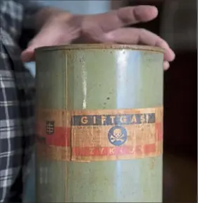  ??  ?? An empty canister of Zyklon B, which was used in gas chambers.