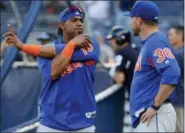 ?? JULIE JACOBSON — THE ASSOCIATED PRESS ?? New York Mets’ Yoenis Cespedes, left, talks with manager Mickey Callaway (36) before a baseball game against the New York Yankees, Friday in New York.
