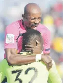  ?? Picture: Gallo Images ?? JOY. Leopards’ Jean Munganga and Rotshidzwa Muleka celebrate after Karabo Tshepe’s goal booked their spot in the Absa Premiershi­p next season.