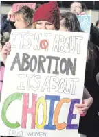  ??  ?? A woman protests against the abortion laws in Northern Ireland