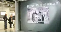  ?? (Special to the Democrat-Gazette/Marcia Schnedler) ?? Visitors admire a photograph outside the National Civil Rights Museum gallery displaying “A Better Life for Their Children: Julius Rosenwald, Booker T. Washington and the 4,978 Schools That Changed America.”