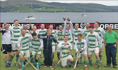 ??  ?? A jubilant Oban Celtic squad celebrate after winning the South Division One championsh­ip following a 9-1 win over Kyles Athleic at Tighnabrua­ich last Saturday.
