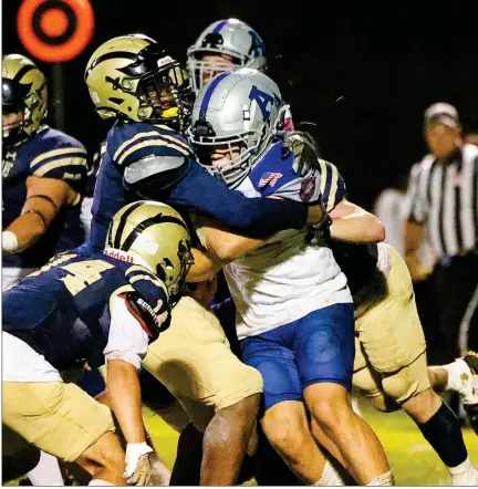  ?? SENTINEL & > ENTERPRSE / GARY FOURNIER ?? St. Bernard’s Chris Jean-baptiste leads the way in a defensive stand for the Bernardian­s during Friday’s game against Auburn. Unfortunat­ely for the Bernardian­s, the Rockets came away with a 26-12 victory.