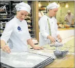  ?? Picture: REUTERS/ ATTILA CSER ?? NEW TASTE: Bakers Maria Malinen and Samuli Malmi bake insect bread in the bakery in Helsinki, Finland