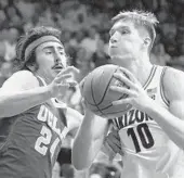  ?? RICK SCUTERI AP ?? Arizona forward Azuolas Tubelis (10) drives on UCLA guard Jaime Jaquez Jr. during the second half.