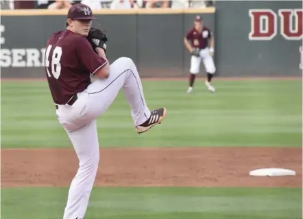  ?? SDN) (Photo by Jason Cleveland, ?? Mississipp­i State pitcher Konnor Pilkington goes into his windup during Friday's game against Auburn.