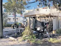  ?? JIM RASSOL/COURTESY ?? Fire damaged the rear storage shed and dumpster area of Rose’s Daughter restaurant in Delray Beach, where fire broke out at about 2:30 p.m. on Tuesday.