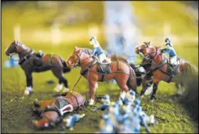  ?? MATT ROTH/THE WASHINGTON POST ?? Rebecca and Ruth Brown’s masterpiec­e, featuring Pickett’s Charge, is their Civil War Tails’ largest diorama, featuring 1,900 clay-sculpted cat soldiers. It took four years to complete.