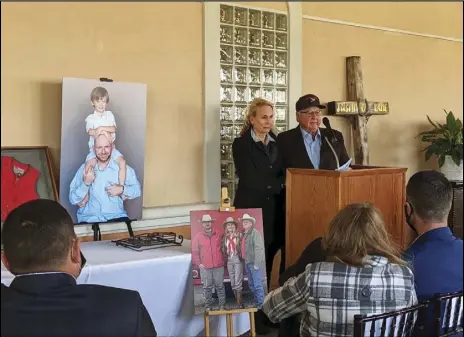  ?? JULIE DRAKE/VALLEY PRESS ?? George Lane (left) talks about his son, Justin George Lane at a Tuesday morning funeral service at Joshua Memorial Park for his late son as George’s wife and Justin’s mother Charlene looks on.