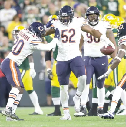  ?? AP ?? Khalil Mack (52) was a dominant force in his first game as a Bear. His addition has changed the dynamic of the team’s roster.