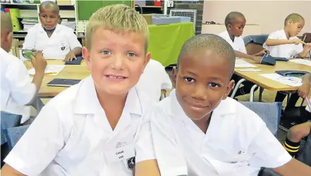  ?? Picture: CHUX FOURIE ?? OFF TO A GREAT START: On their first day of school, these two Grade 1s at Queen’s Junior started working towards their careers which, for Caleb Stander, left, was ‘a nice job’ while Amila Sixaba wants to be a soccer player for PSG, no less
