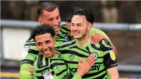  ??  ?? Aaron Collins, right, is congratula­ted by his Forest Green team-mates after scoring against Newport in the League Two play-off semi-final second leg