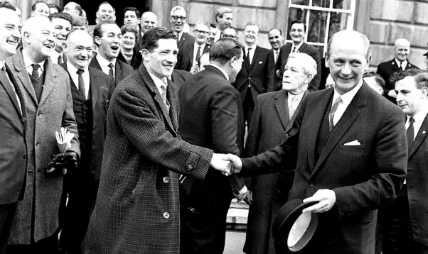  ??  ?? FATHER FIGURE: Jack Lynch is congratula­ted outside Leinster House after becoming Taoiseach in 1966