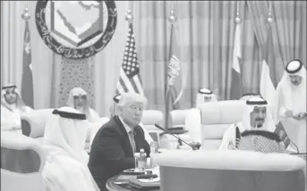  ?? REUTERS/Jonathan Ernst ?? U.S. President Donald Trump sits down to a meeting with of Gulf Cooperatio­n Council leaders, including Saudi Arabia’s King Salman bin Abdulaziz Al Saud (R), during their summit in Riyadh, Saudi Arabia May 21, 2017.