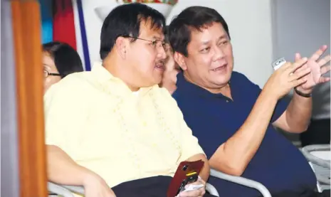  ?? (SUN.STAR FILE) ?? MISSING A FRIEND. Rep. Tomas Osmeña (right) and DILG Secretary Jesse Robredo in happier times. Osmeña says he is still grieving the loss of Robredo, whom he considered a personal friend. Robredo died in a plane crash last Aug. 18.