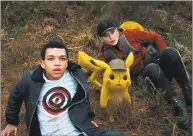  ?? Warner Bros. Pictures / TNS ?? Justice Smith and Kathryn Newton in a scene from “Pokemon Detective Pikachu.”