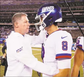  ?? Elsa / Getty Images ?? Giants head coach Pat Shurmur consoles quarterbac­k Daniel Jones after the loss to the Cowboys at MetLife Stadium on Monday in East Rutherford, N.J.