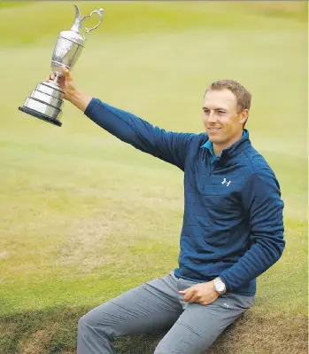  ?? GREGORY SHAMUS/GETTY IMAGES ?? Jordan Spieth poses with the Claret Jug on a bunker on the 18th green after winning the British Open by three strokes at Royal Birkdale in Southport, England, on Sunday.