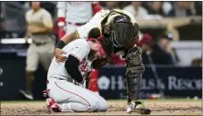  ?? DERRICK TUSKAN — THE ASSOCIATED PRESS ?? Philadelph­ia Phillies’ Bryce Harper, bottom, reacts after being hit by a pitch from San Diego Padres’ Blake Snell as Padres catcher Jorge Alfaro checks on him duirng the fourth inning of a baseball game on Saturday night.