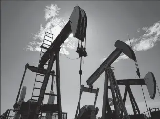  ?? CP PHOTO ?? Pumpjacks are shown pumping crude oil near Halkirk, Alta., in 2007.