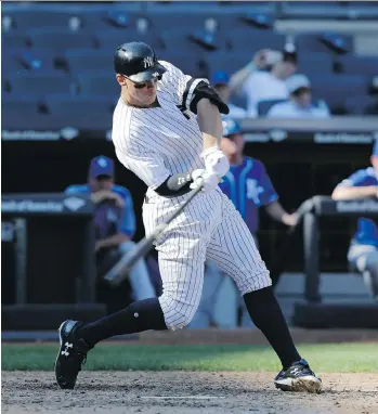  ?? SETH WENIG/THE ASSOCIATED PRESS ?? Aaron Judge of the New York Yankees hits his 50th home run of the season on Monday against the Kansas City Royals, his second of the day, to set a new MLB rookie record.