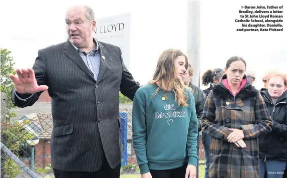  ?? Robert Melen ?? &gt; Byron John, father of Bradley, delivers a letter to St John Lloyd Roman Catholic School, alongside his daughter, Danielle, and partner, Kate Pickard