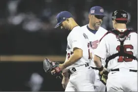  ?? GODOFREDO A. VÁSQUEZ/AP ?? UNITED STATES PITCHER NICK MARTINEZ (LEFT) exits during the third inning of a game against Mexico in Phoenix on Sunday.