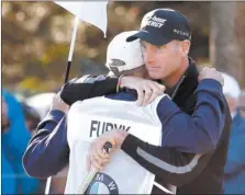  ?? CHARLES REX ARBOGAST/AP PHOTO ?? Jim Furyk, right, hugs his caddie Mike ‘‘Fluff’’ Cowan after shooting a 12-under-par 59 Friday at the BMW Championsh­ip at Conway Farms Golf Club in Lake Forest, Ill.