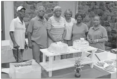  ?? / Spencer Lahr ?? Fairview School alumni Leo Word (from left), Eddie Hood, Eva Whatley, Christine Dorsey, Severa Fife and Bernice Jackson stand by the sweet table during Friday’s barbecue sale to benefit restoratio­n efforts of the rural school in Cave Spring.