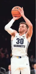  ?? NOAH K. MURRAY / USA TODAY SPORTS ?? Andrew Rowsey of Marquette launches a shot against DePaul on Wednesday.