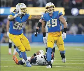  ?? Marcio Jose Sanchez Associated Press ?? LINEBACKER Drue Tranquill (49) picked up two key sacks of Russell Wilson in the Chargers’ 19-16 overtime victory over the Denver Broncos on Monday night.