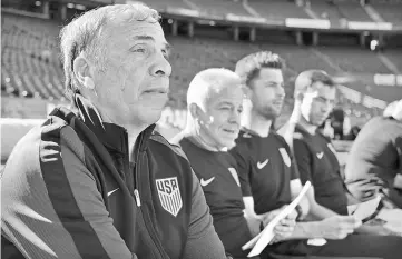  ??  ?? Bruce Arena (left) looks on before the game against the Serbia at Qualcomm Stadium. — USA TODAY Sports