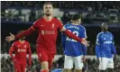  ?? Photograph: Jon Super/AP ?? Liverpool’s Jordan Henderson celebrates after opening the scoring against Everton.