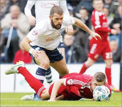  ??  ?? NOSE-DIVE: Swindon are in trouble as Preston’s John Welsh threatens