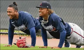  ?? CURTIS COMPTON / CCOMPTON@AJC.COM ?? There are some reasons to think the short season might hurt Braves such as Ozzie Albies (left) and Ronald Acuna, who tend to slump in May.