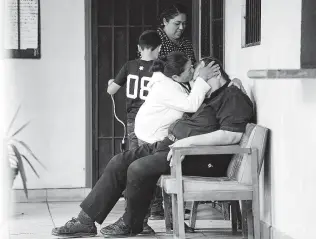  ?? Elizabeth Conley / Staff photograph­er ?? The Rev. Jeffrey David Newell gets a kiss from a parishione­r at Our Lady of the Incarnatio­n in Tijuana, Mexico, in November. Newell was on a 2018 list of priests credibly accused of sex abuse.