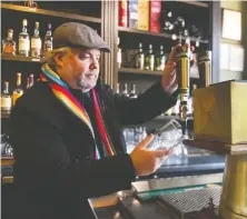  ?? JASON PAYNE ?? Sean Heather makes sure the Guinness is pouring smoothly in his Gastown bar The Irish Heather. The watering hole will soon move.